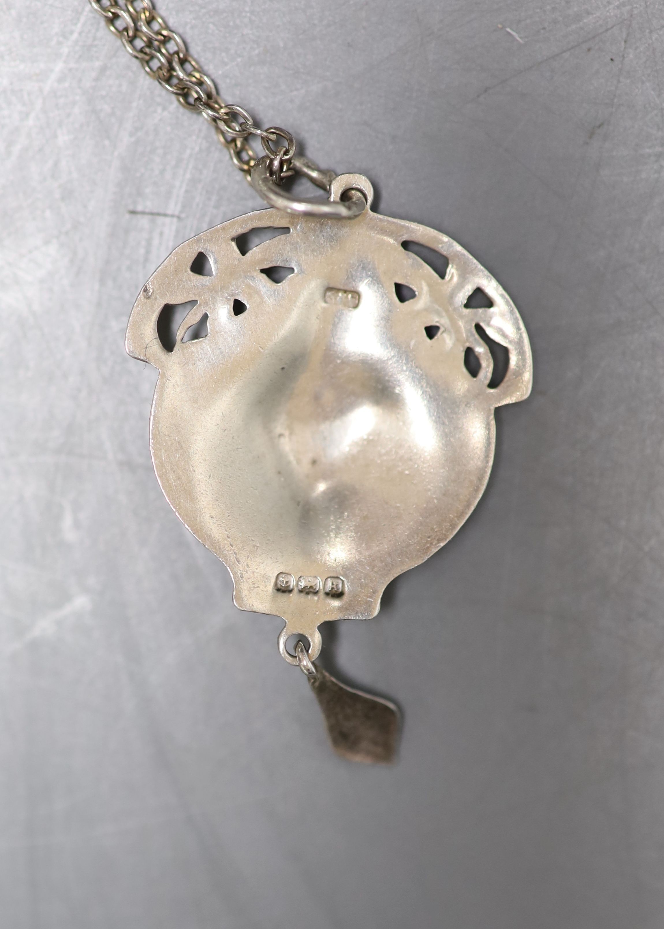 An Edwardian Art Nouveau silver and polychrome enamel set drop pendant, Birmingham, 1909, 43mm, on a white metal chain.